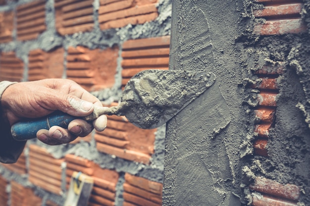 bricklaying construction worker building brick wall 1150 14756